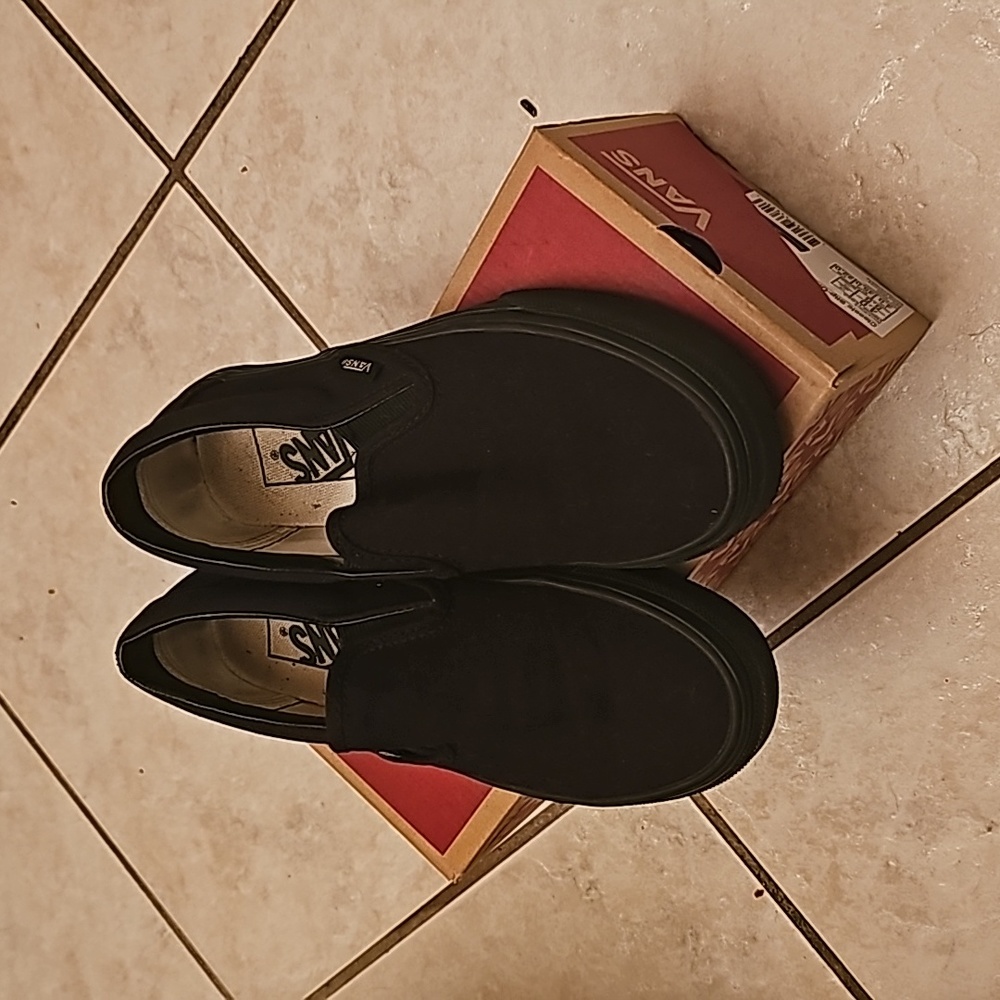 Black slip-on Vans